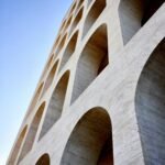 brown concrete bridge under blue sky during daytime