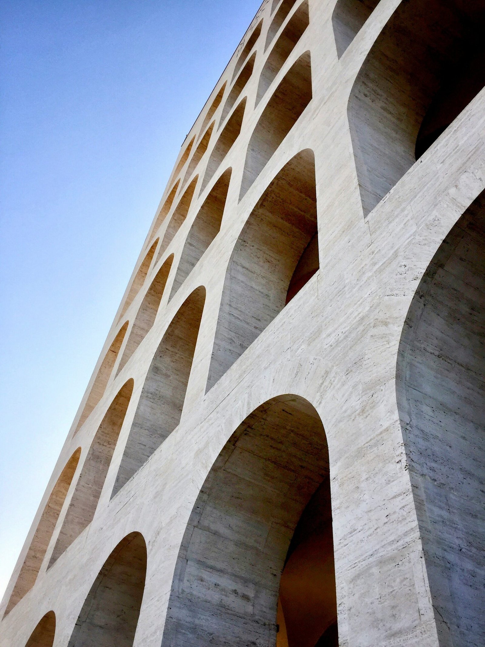 brown concrete bridge under blue sky during daytime